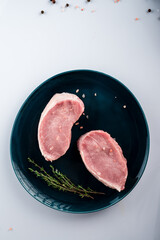 sliced raw pork meat on white background. Top view. Flat lay