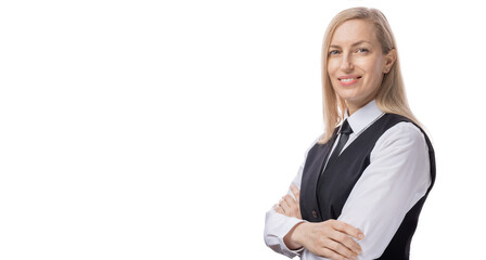 Positive caucasian woman in white shirt, black tie and waistcoat posing in studio with crossed arms. Portrait of confident business lady with blond hair.