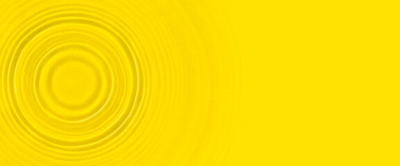 Abstract yellow water over sunlight. Top view, flat lay. Banner