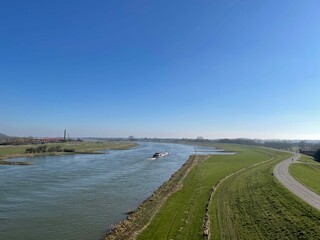 Fototapeta na wymiar Cargo ship on the river Nederrijn around Heteren