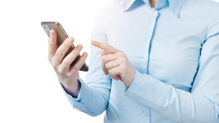Business woman in formal wear typing messages on modern smartphone while standing over white background. Close up of cell phone in female hands.