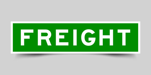 Sticker label with word freight in green color on gray background