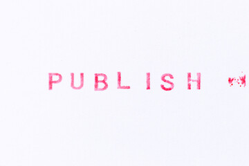 Red color ink rubber stamp in word publish on white paper background