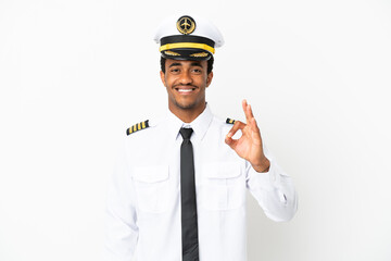 African American Airplane pilot over isolated white background showing ok sign with fingers - obrazy, fototapety, plakaty