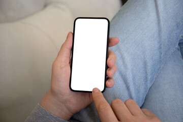 male hands holding phone with isolated screen on denim pants