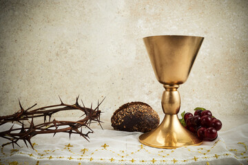 Easter background with crown of thorns and Chalice with red wine as concept for Christ blood