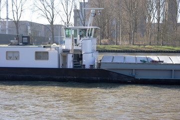 Wheelhouse and living area of a cargo ship in a canal © photosis