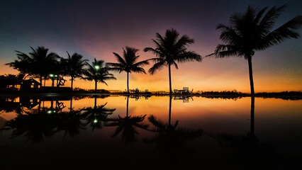 Fototapeta na wymiar Sunrise reflection in the beach pool