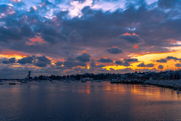 Naklejka na ściany i meble sunset over the sea. beautiful reflecition of natural sunset clouds.