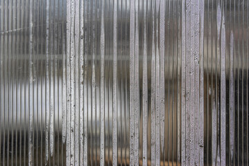 Porous polycarbonate sheet with condensation drops inside. Polycarbonate greenhouse wall - obrazy, fototapety, plakaty