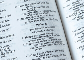 Psalm 32, the joy of forgiveness verses, open Holy Bible Book. A closeup. The Christian biblical...