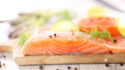 raw salmon fillet on board