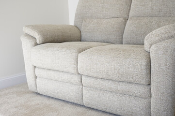 Neutral colour home interior showing sofa and carpet