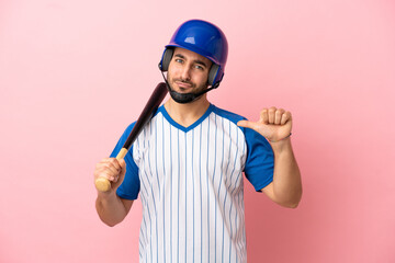 Baseball player with helmet and bat isolated on pink background proud and self-satisfied