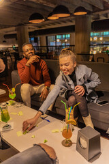 Laughing and taking another word