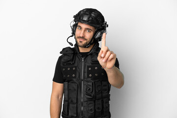 Young caucasian swat isolated on white background showing and lifting a finger