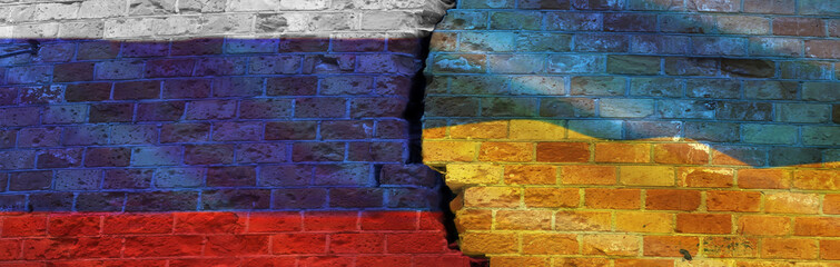 Banner of flags of Ukraine and Russia on a cracked brick wall. Concept of military conflict between Ukraine and Russia