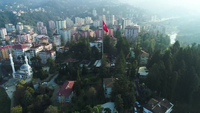 Aerial 4K footage of the Turkish flag waving in the city of Rize.