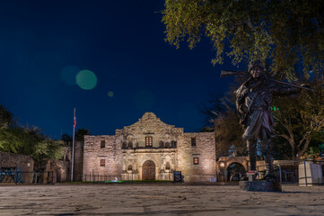 View of the San Antonio Alamo and Bronze Statue at Night