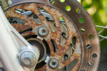 Motorcycle brake disc without wheels. rust with repair.
