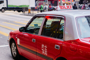 Red cab taxi in a street downtown in Central Hong Kong.