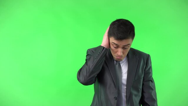 Guilty man in suit shrugging shoulders and disguising