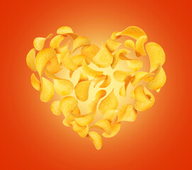 Potato chips in the air in the shape of a heart on a red background