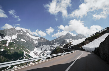 Asphalt road in Alp mountains. Road trip concept. Beautiful landscape.