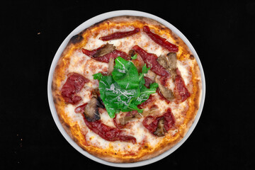 Delicious Italian Pizza On The Black Background