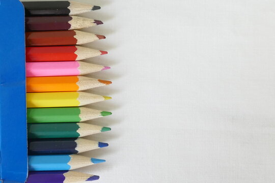 Multi colour pencils against white background