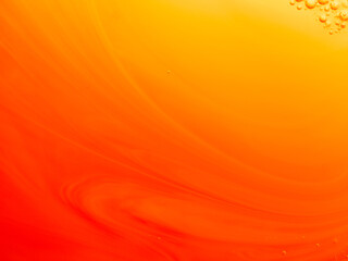 Yellow and orange background with bubbles and a pattern made with liquid soap, abstract background