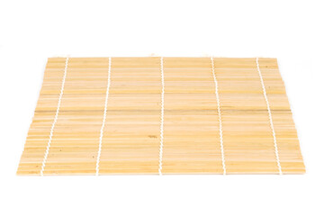 chopsticks on bamboo mat isolated on white background