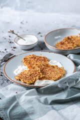 Potato pancakes with sour cream and garlic