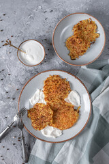Potato pancakes with sour cream and garlic