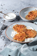 Potato pancakes with sour cream and garlic