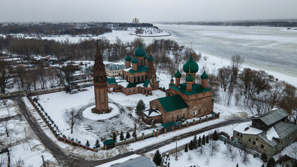 Beautiful old church with towers and domes. Winter day. Overcast weather. Ancient architecture.