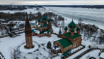 Beautiful old church with towers and domes. Winter day. Overcast weather. Ancient architecture.