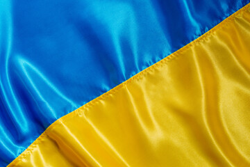 Texture of national satin fabric textile flag of Ukraine