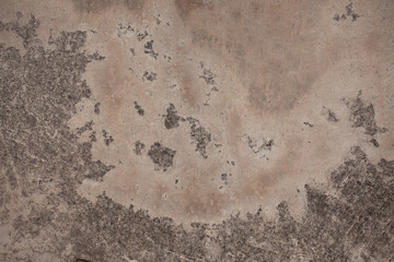 The cement wall background is getting old and dirty