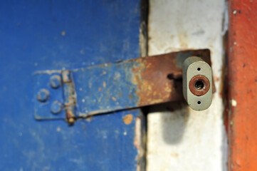 Padlock keyhole on blue wooden door background
