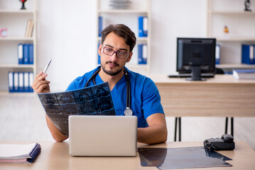 Young male doctor radiologist working in the clinic