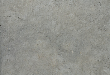 Grey concrete background. Cement wall with cracks.
