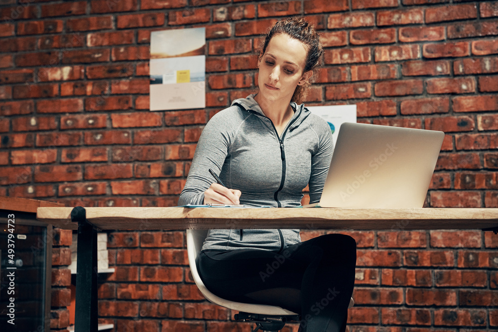 Aufkleber Its time to renew subscriptions. Cropped shot of a fitness instructor making notes while using a laptop.