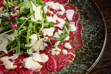carpaccio with arugula salad