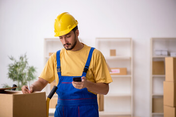 Young male contractor doing home relocation