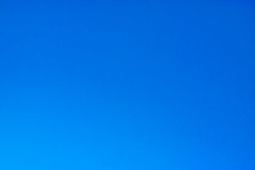 Fototapeta na wymiar Clear cloudless sky. Blue background.