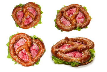 Pretzel with salami and lettuce isolated on a white background.