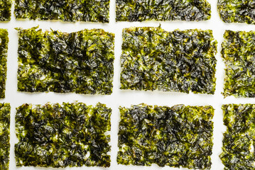 Tasty nori seaweed isolated on white. - obrazy, fototapety, plakaty