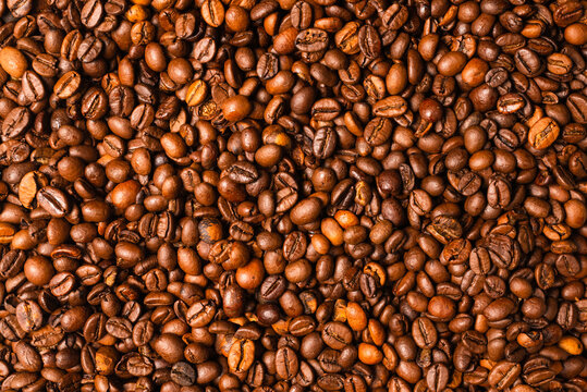 Coffee beans on a white background. Top view. © Nikolay
