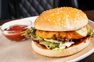 burger with sauce on plate